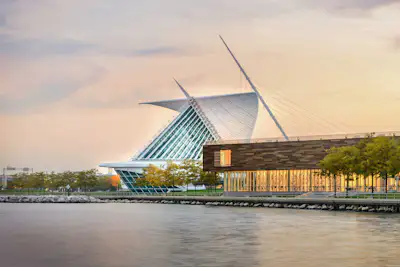 The Milwaukee Art Museum and Milwaukee skyline as seen aerially from over Lake Michigan looking West. 