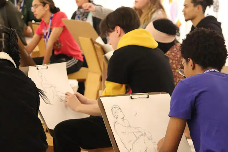 Group of teens sketching